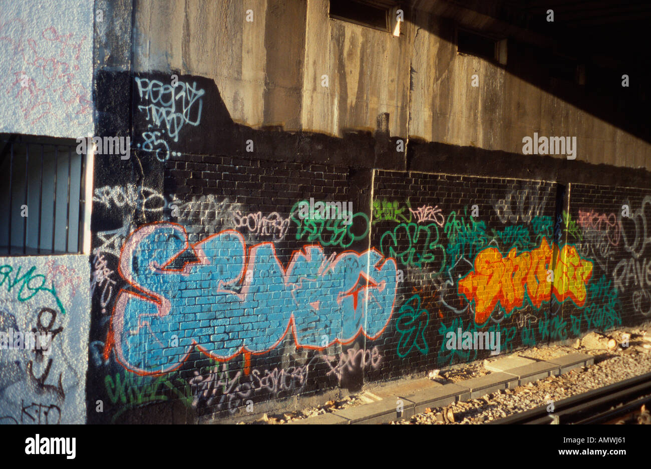 Graffiti alongside railway track Gunnersbury station, London, UK Stock Photo