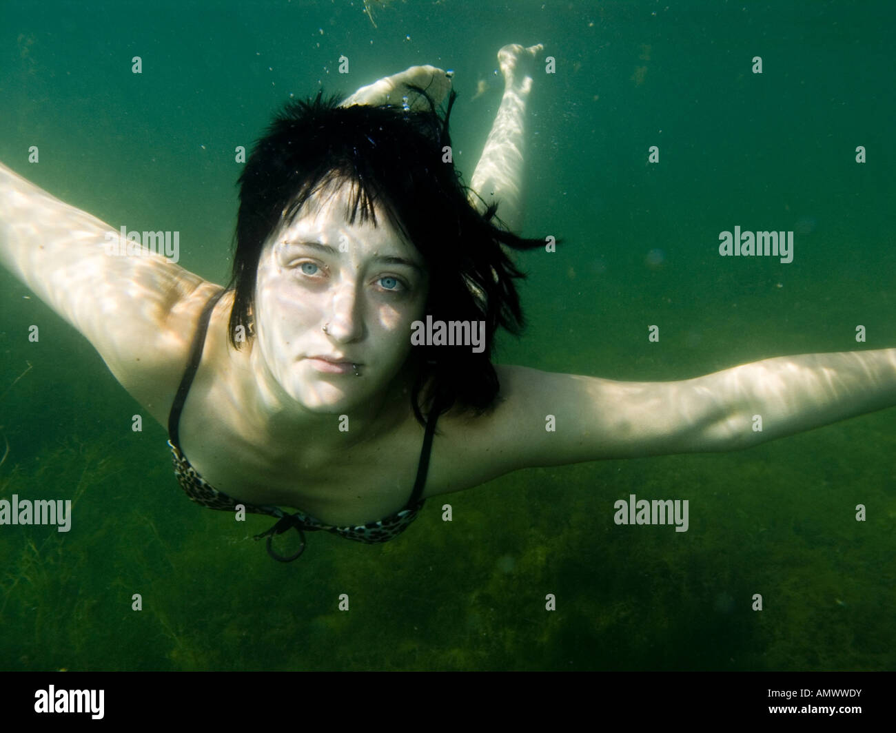 young woman under water Stock Photo - Alamy