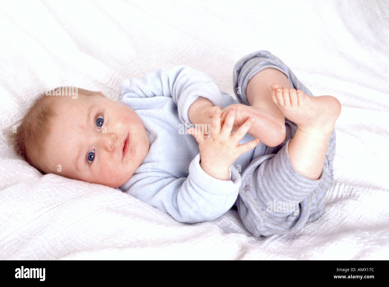 Baby Playing With Toes Stock Photo