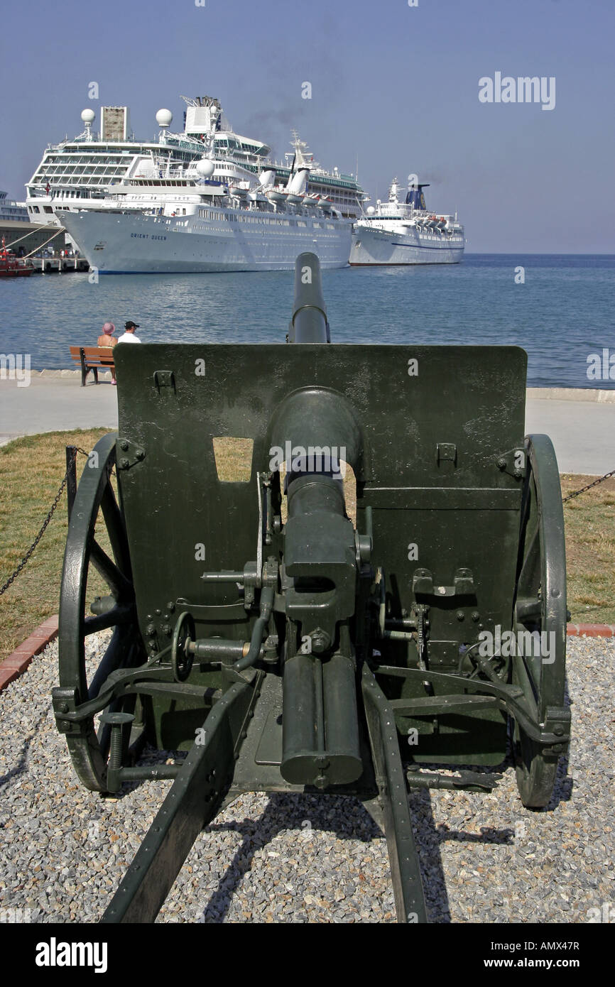 old cannon taking aim at cruise liners in the habour of Kusadasi, Battleships, Turkey, Kusadasi Stock Photo
