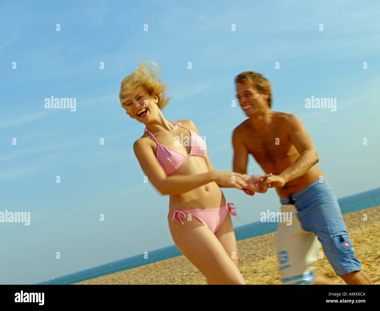 Couple Having Fun on Beach Stock Photo