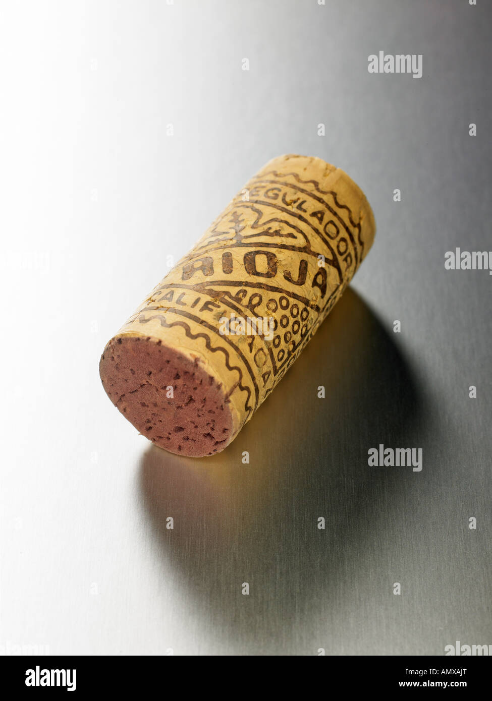 Rioja wine cork on silver surface with shadow. Stock Photo