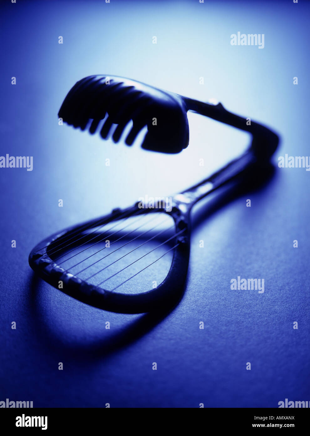 Metal egg slicer on blue Stock Photo Alamy