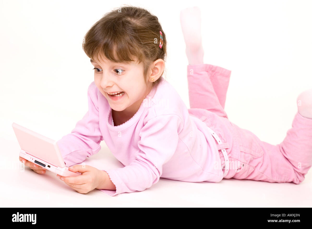 Girl playing with gameboy Stock Photo
