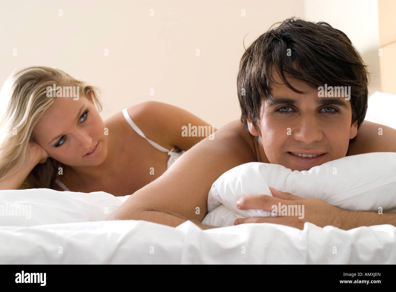 Couple lying in bed Stock Photo