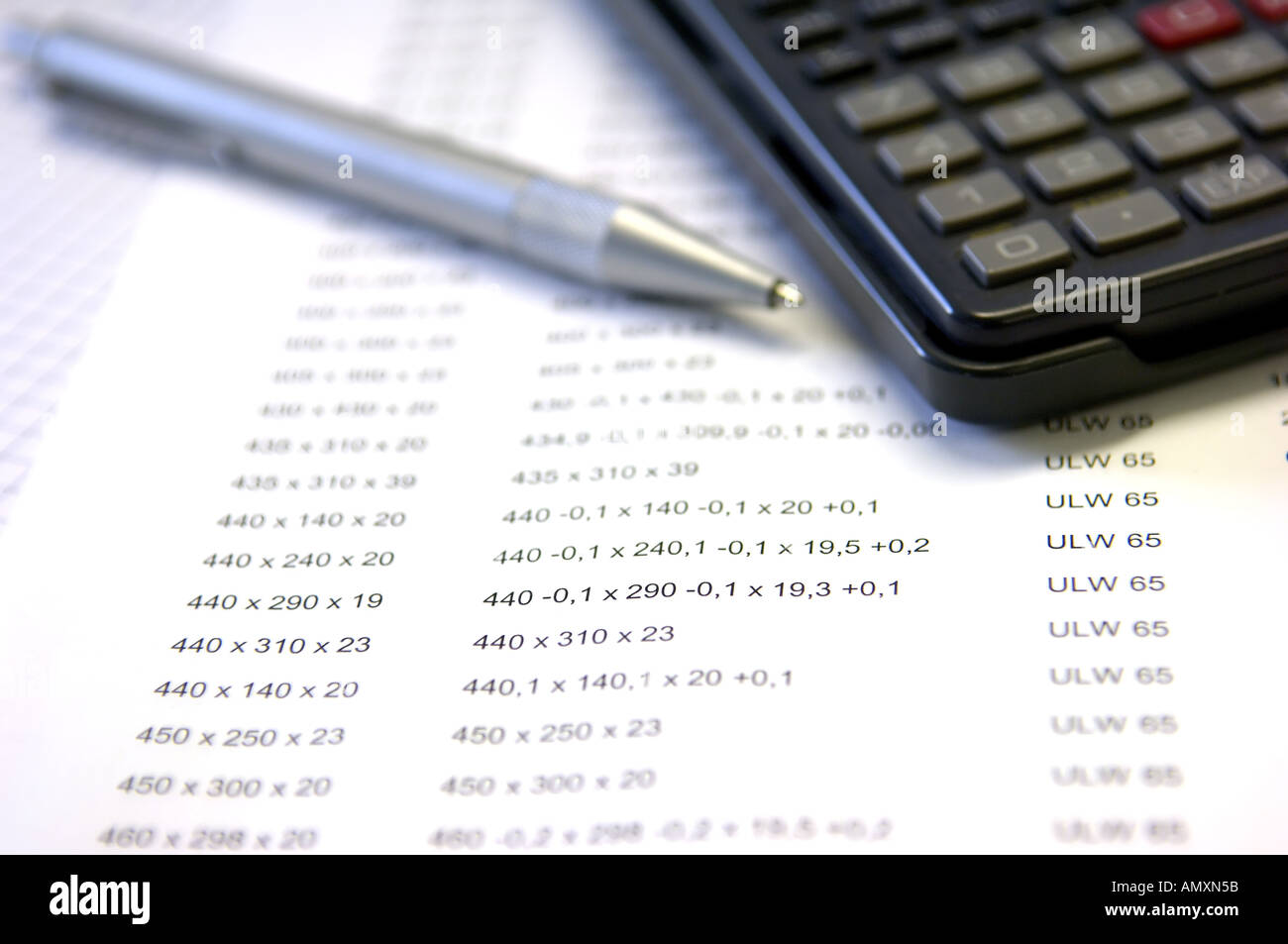 Ballpen calculator lying on list hires stock photography and images
