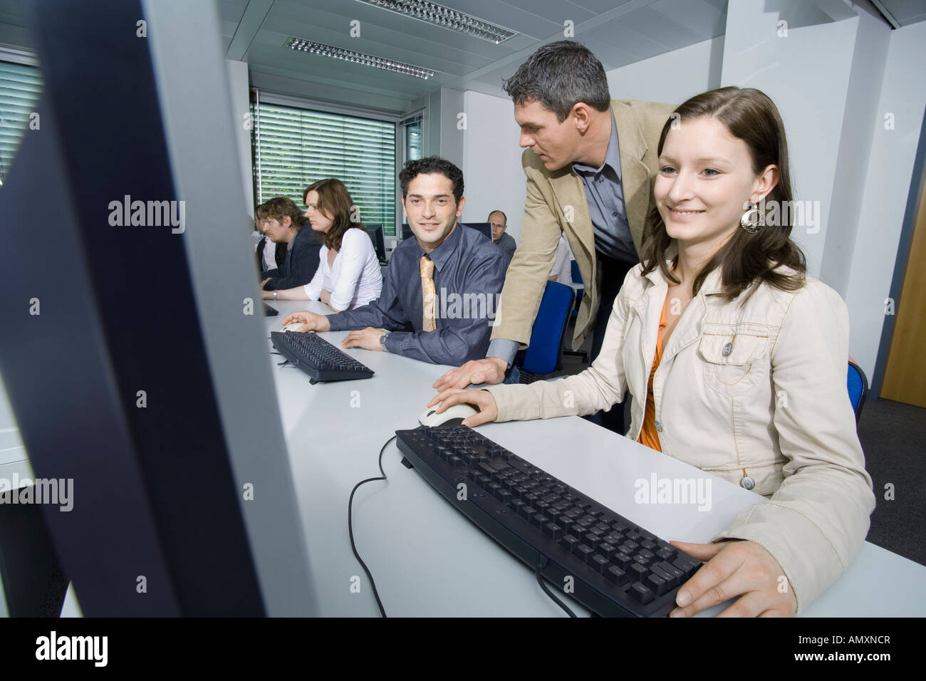 Group of people using computer Stock Photo - Alamy