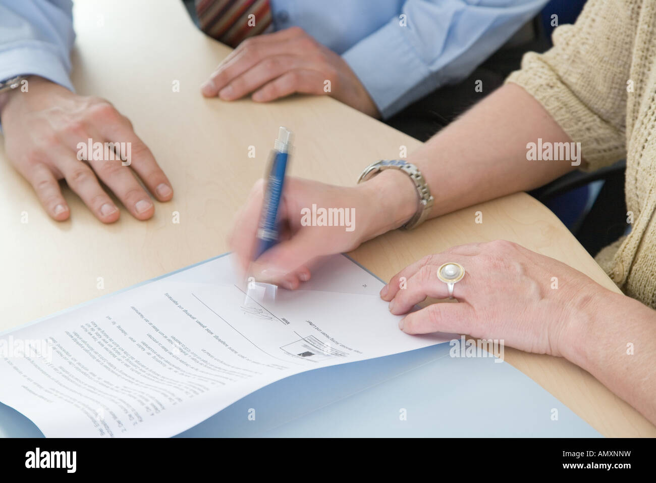 Businesswomen signing contract Stock Photo