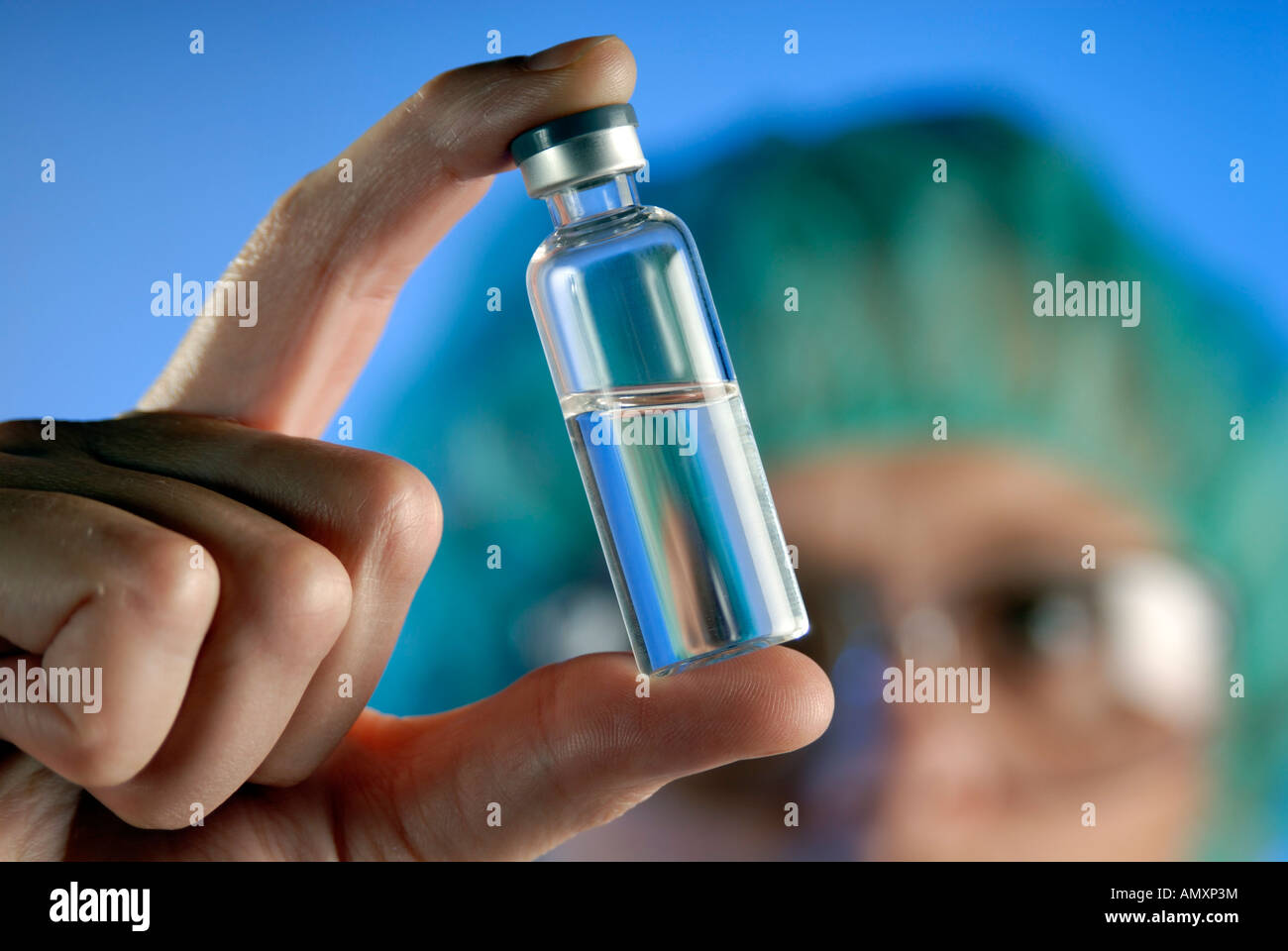 Medical researcher with bottle of medicine Stock Photo