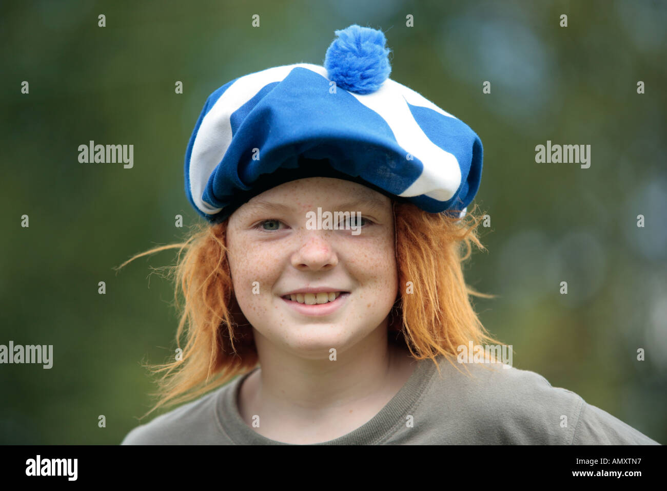 boy with funny hat with Scottish colours and red hair Stock Photo