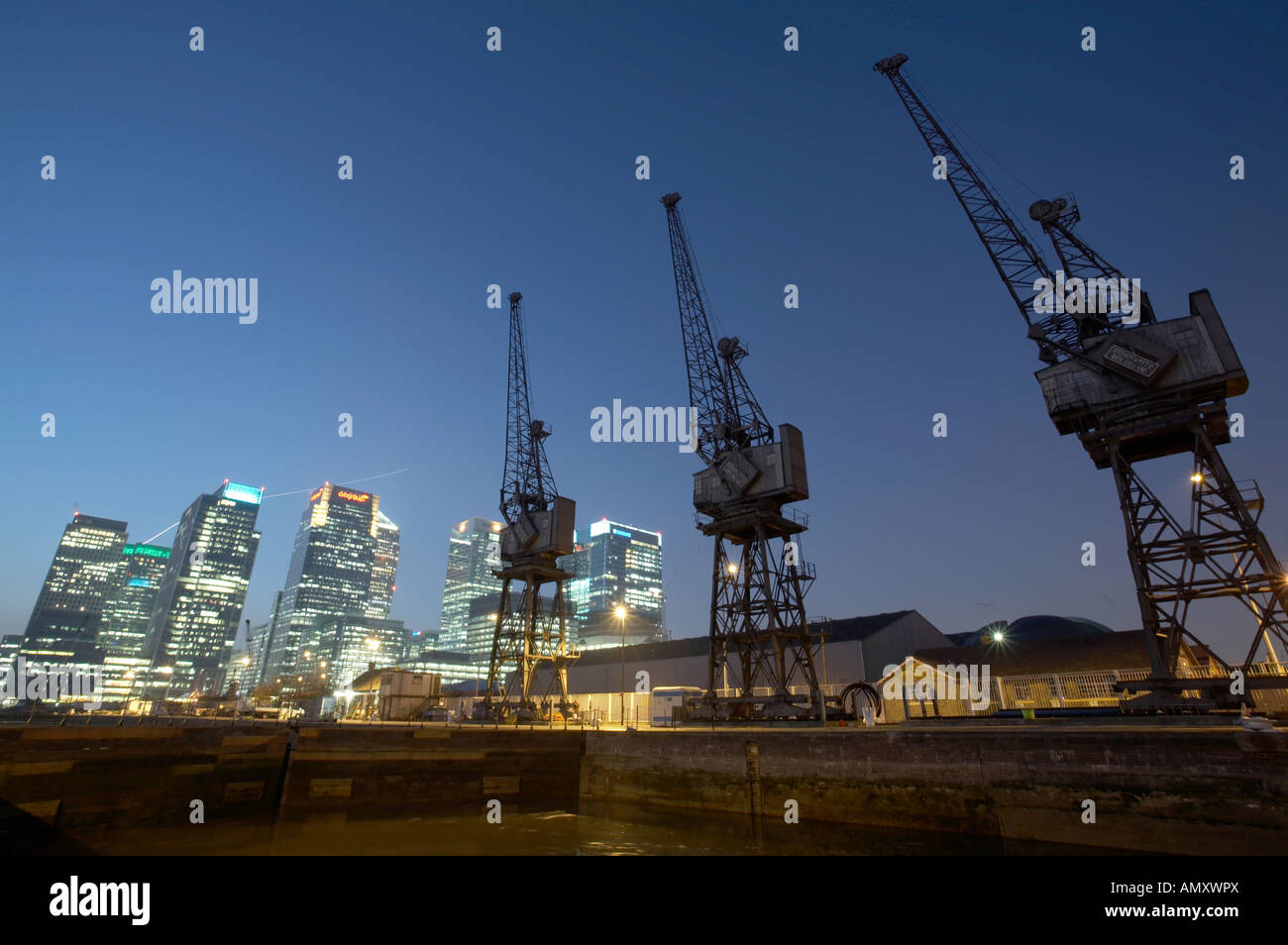 Canary Wharf docklands skyline with cranes london england uk night dusk ...