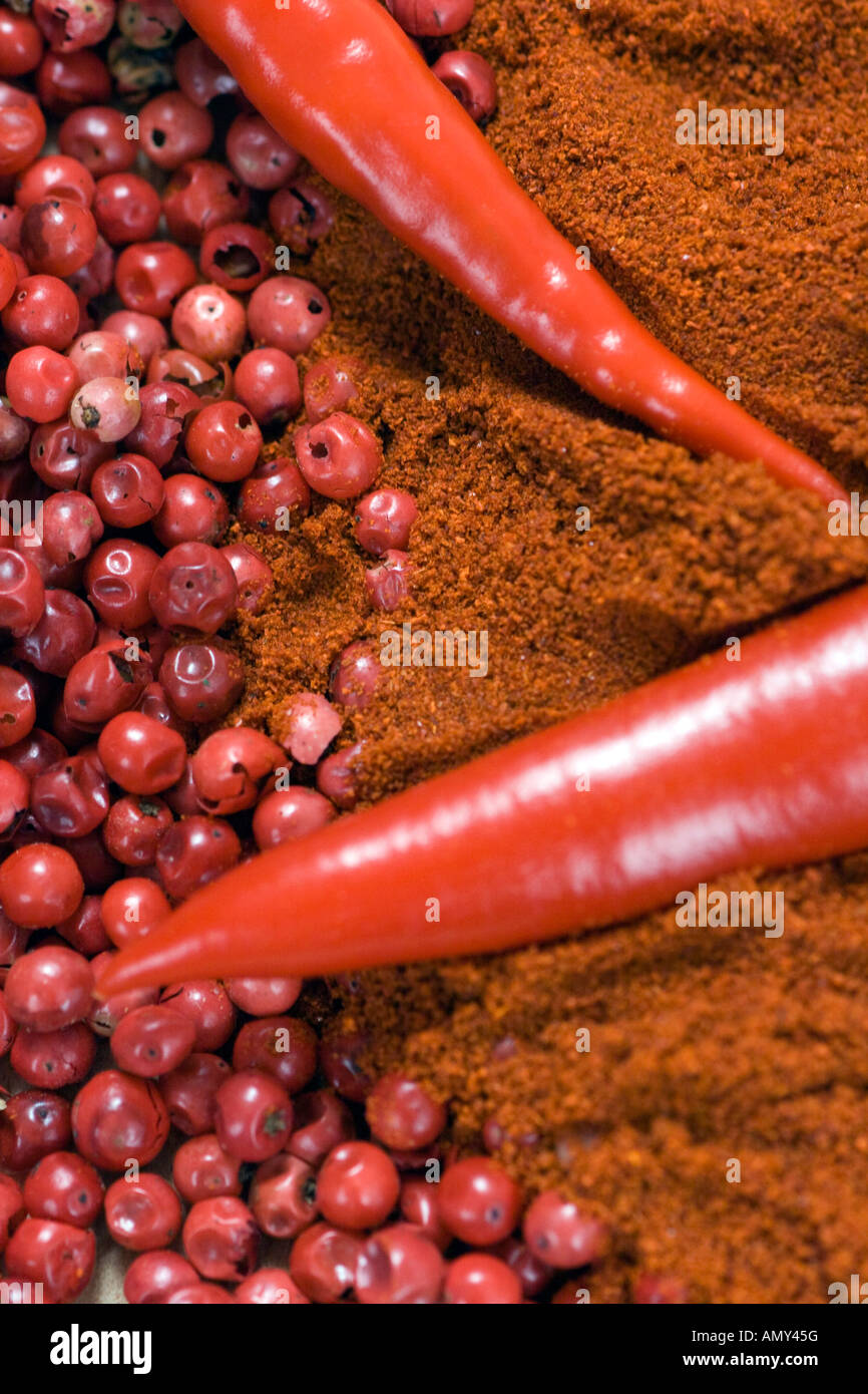 Close-up of chilli powder, red chilli pepper and peppercorns Stock Photo