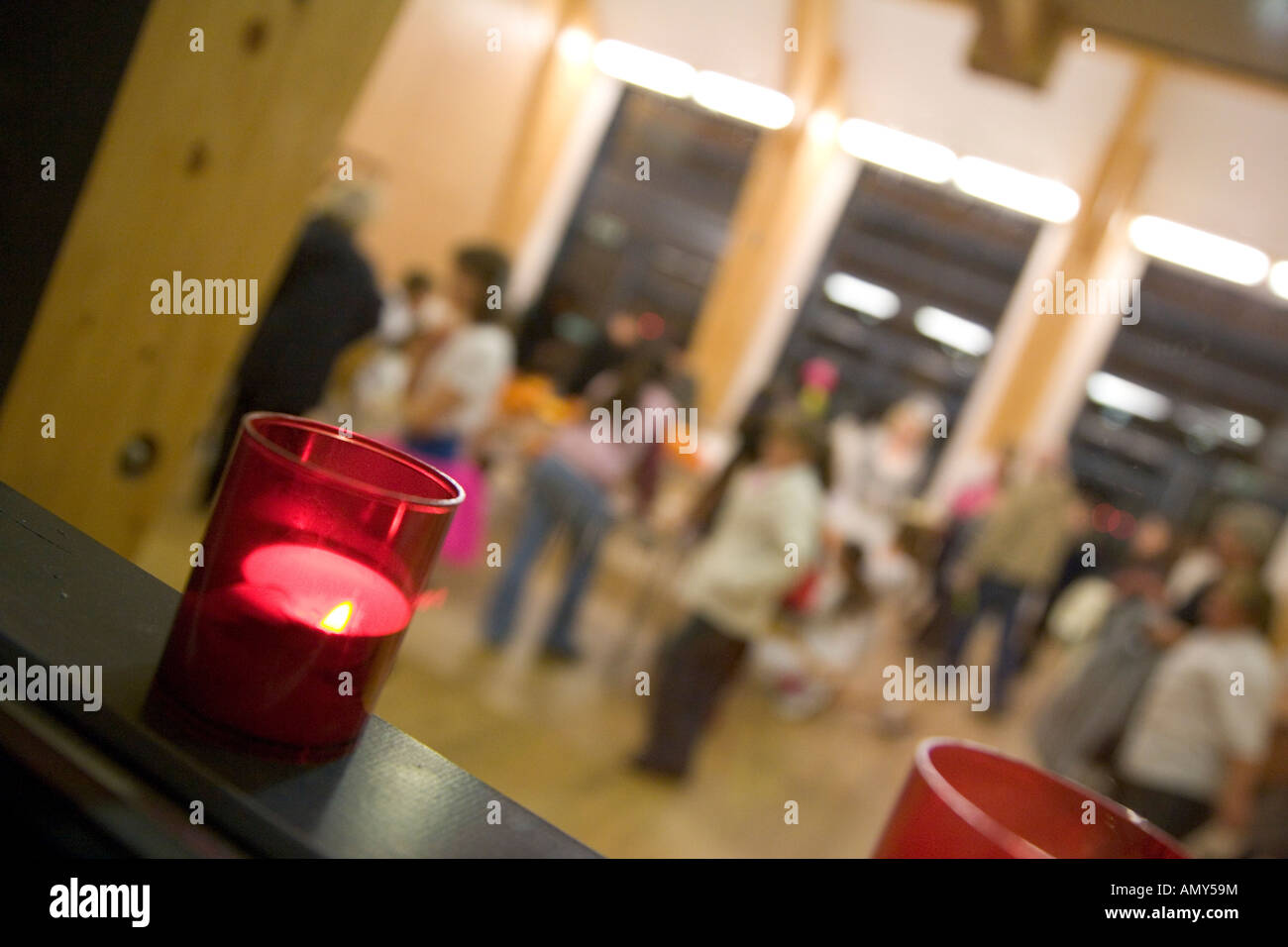 Candles in window of church hall at alternative Halloween Night of Light event October 31st Stock Photo