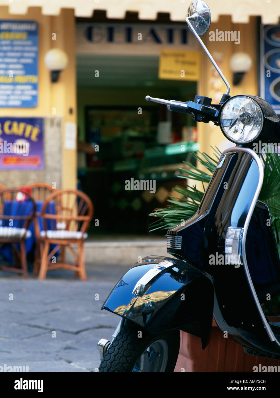 Vespa scooter parked outside Gelati shop Tropea Calabria Italy Stock