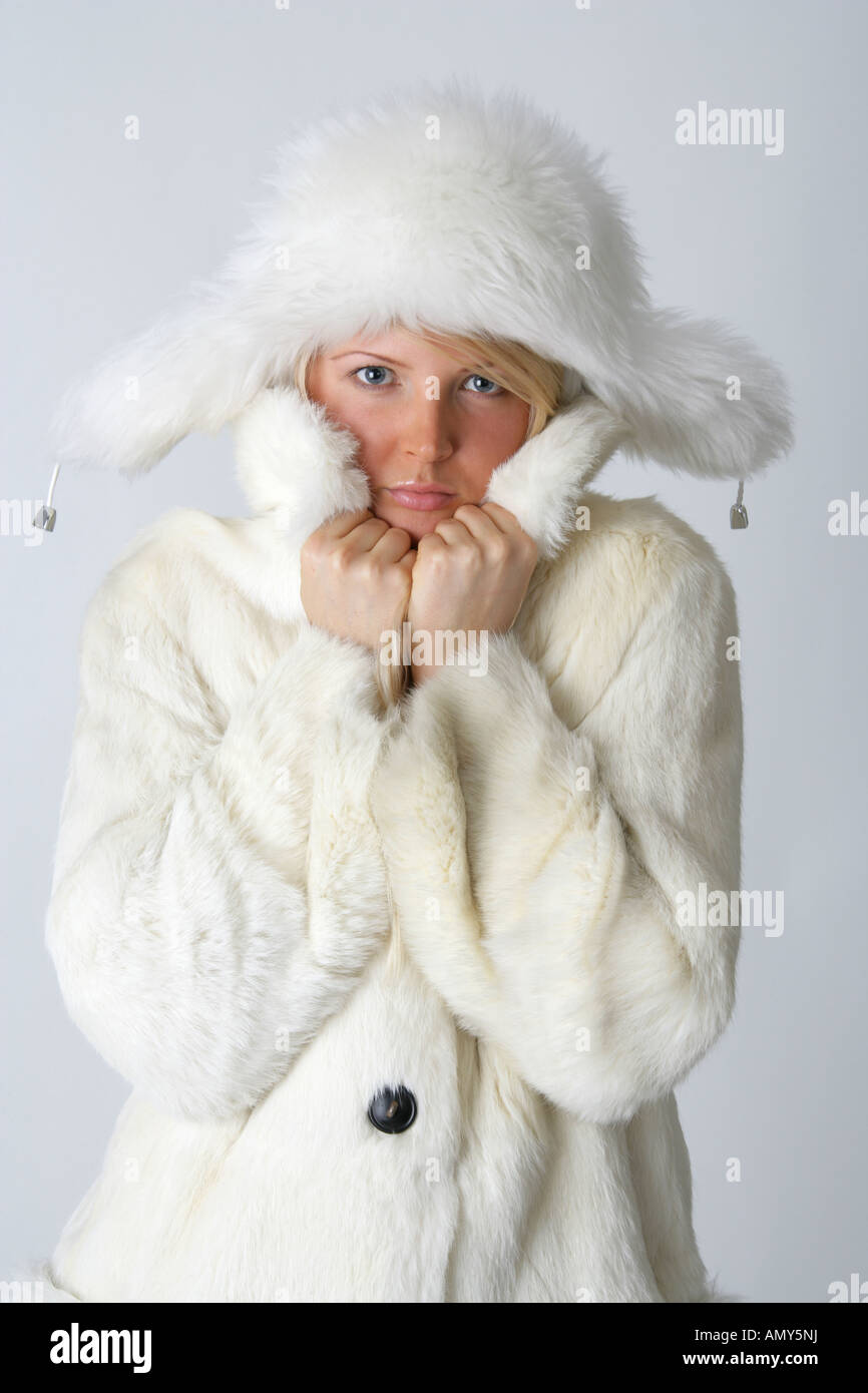 Blonde Girl in a White Fur Coat and Hat Stock Photo - Alamy