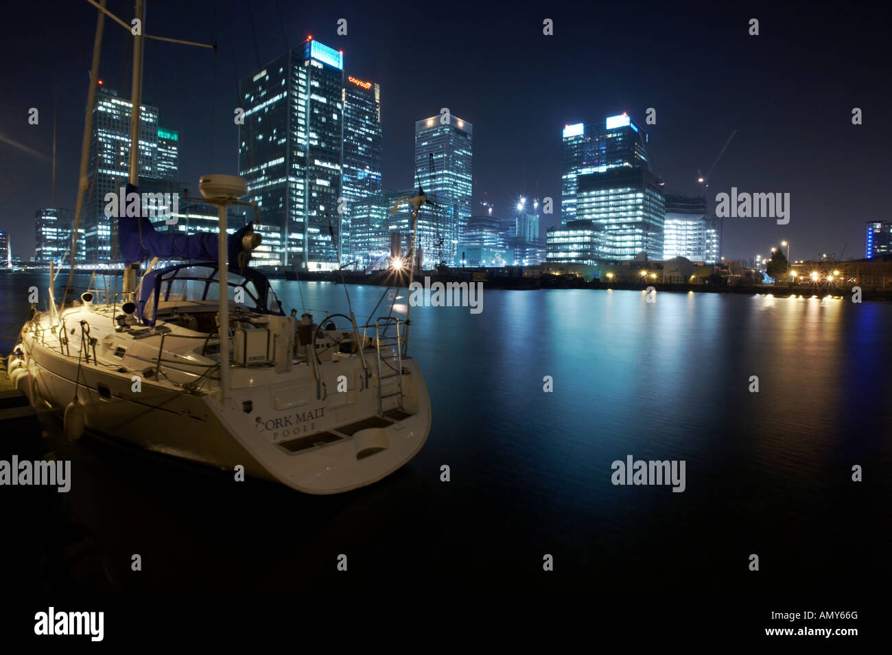 boat on the waterfront in Canary Wharf docklands london england uk ...