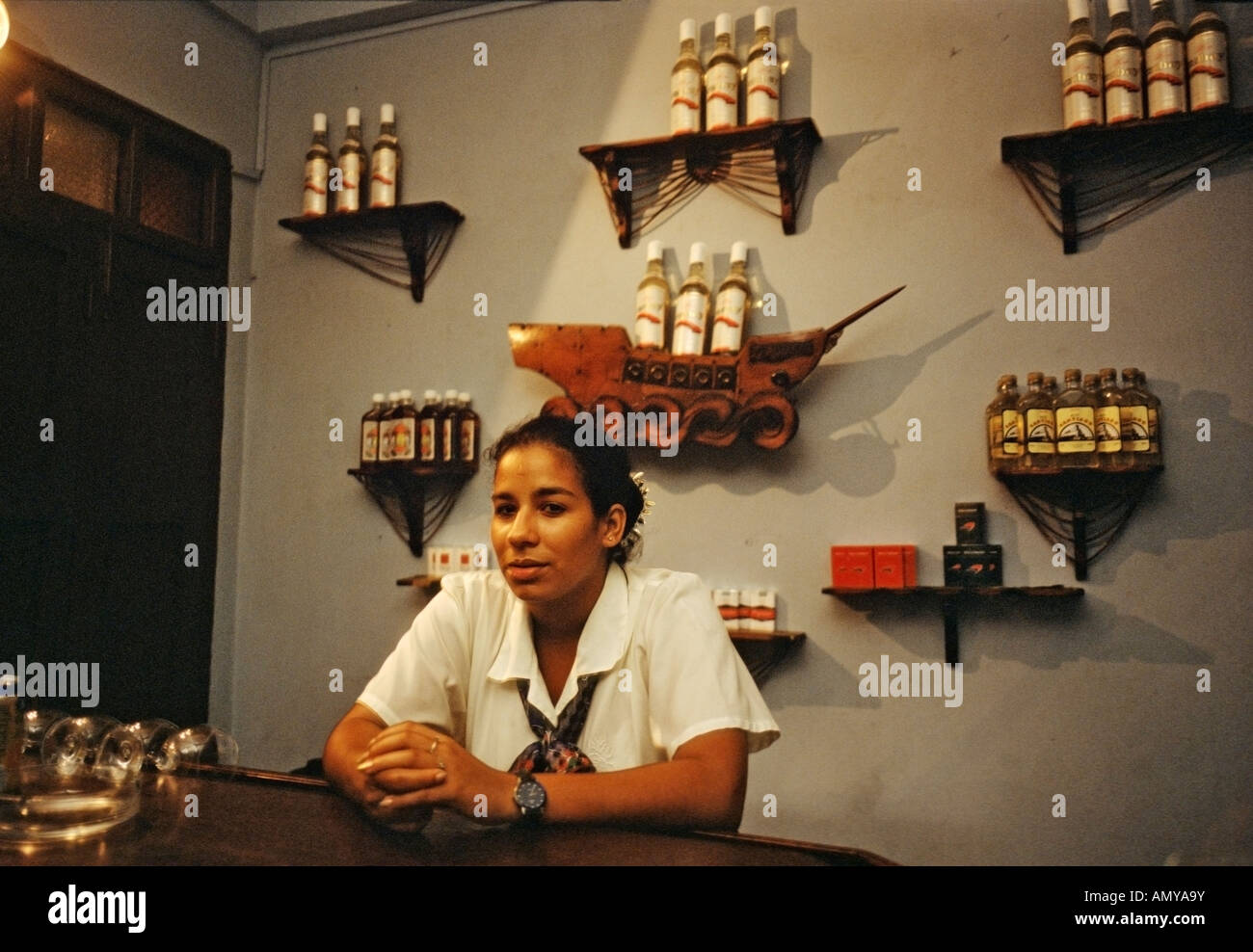 Female bartender in the lounge of a the Hotel La Rusa in Baracoa Cuba Stock Photo