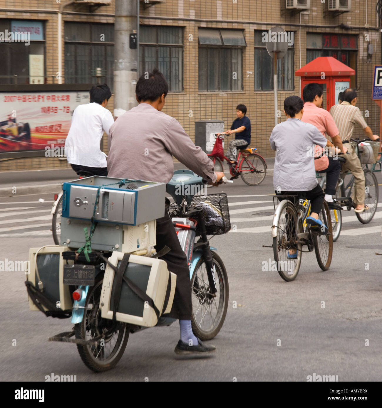China Shanghai Downtown computers and screens tied up on the rack at the back of a motorcycle Stock Photo