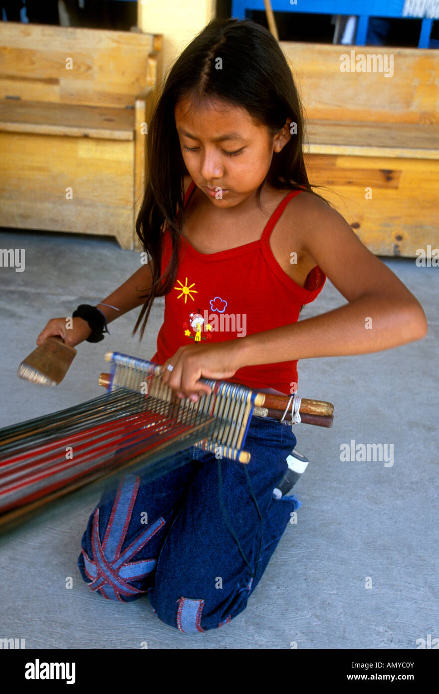 Mexican village girl 1, one, Mexican girl, Mexican girl, young girl, weaver, weaving, weaving on  loom, loom, village, Santo Tomas Jalieza, Oaxaca State, Mexico Stock Photo  - Alamy