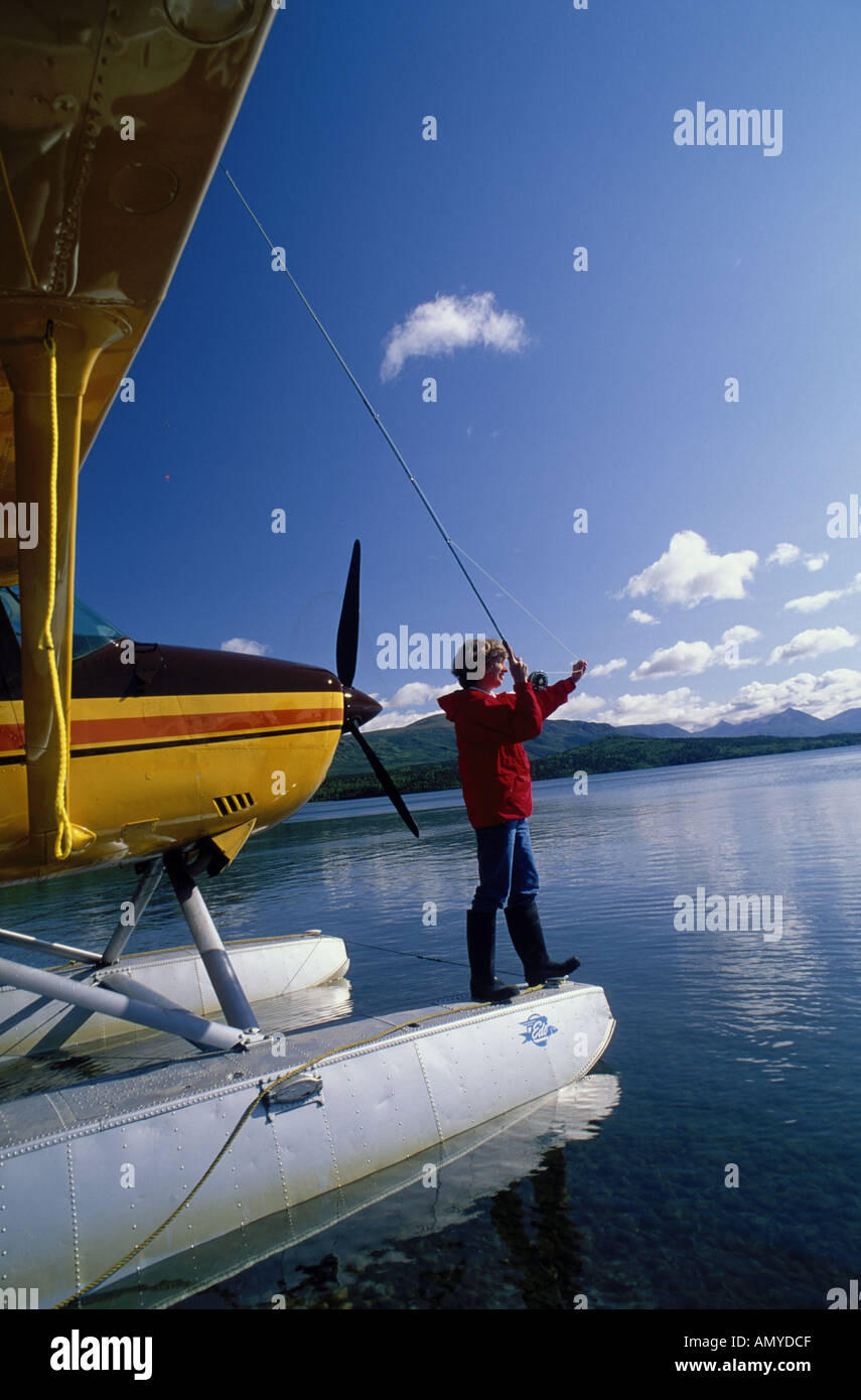 Woman Fly Fishing from Float plane Grosvenor Lake Katmai Stock Photo