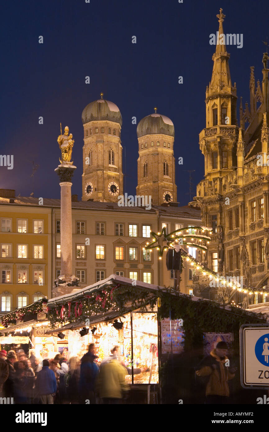 christmas market on Marien Place Munich with Marien clumn townhall and cathedral Bavaria Germany Stock Photo