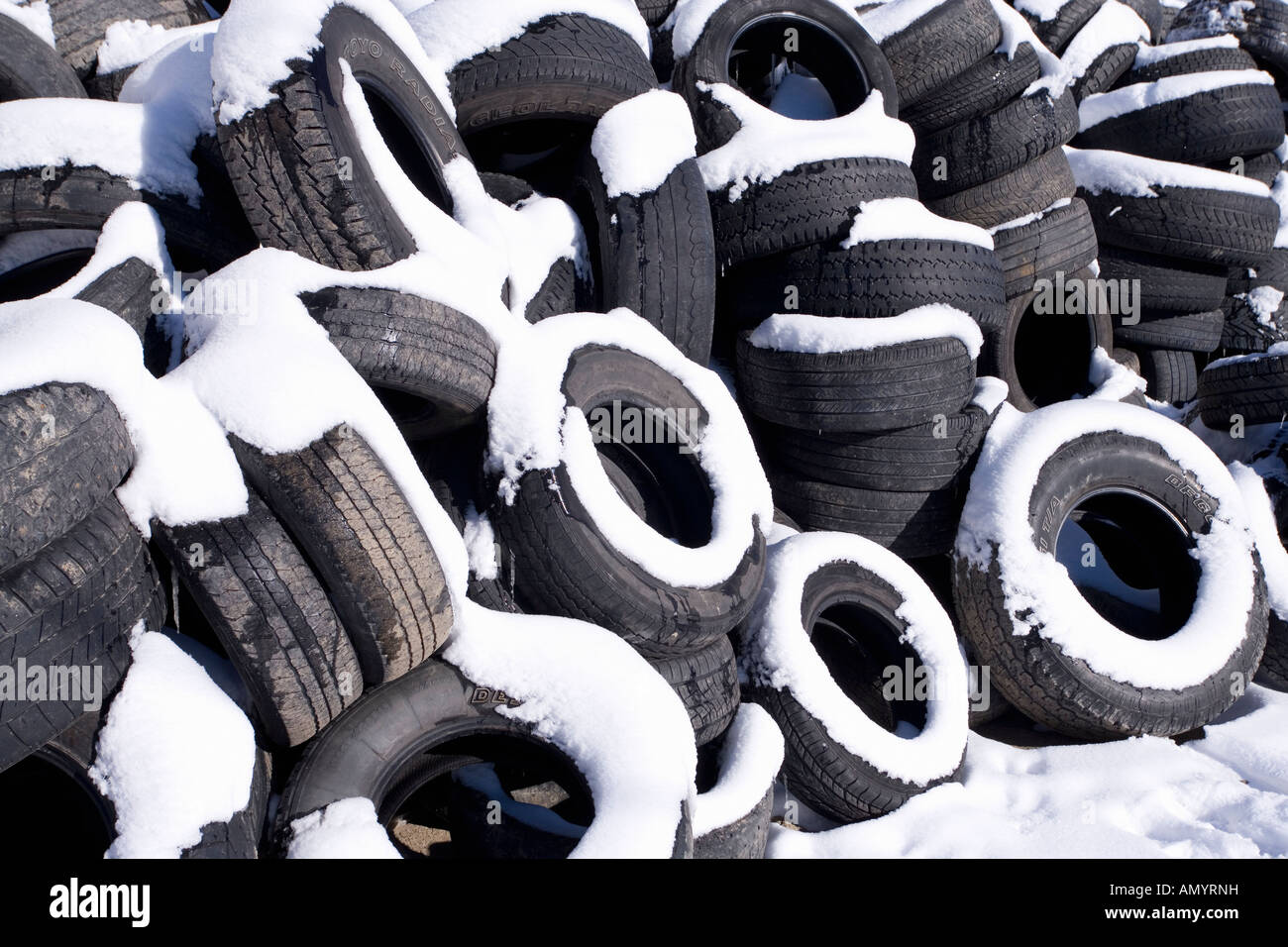 Used automobile car tires covered in Winter snow Stock Photo Alamy