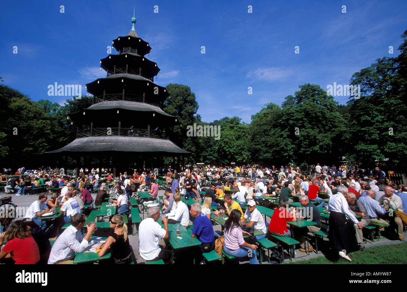 Germany Bavaria Munich people sitting at the Chinese Tower beer garden in the Englischer Garten Stock Photo