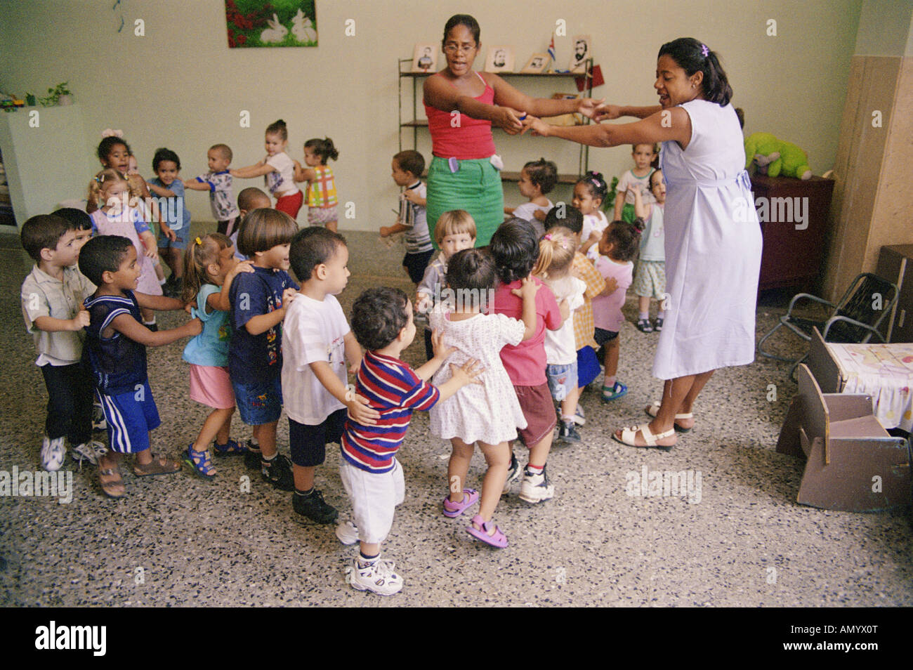 Nursery school children playing game in classroom. Cuba Stock Photo