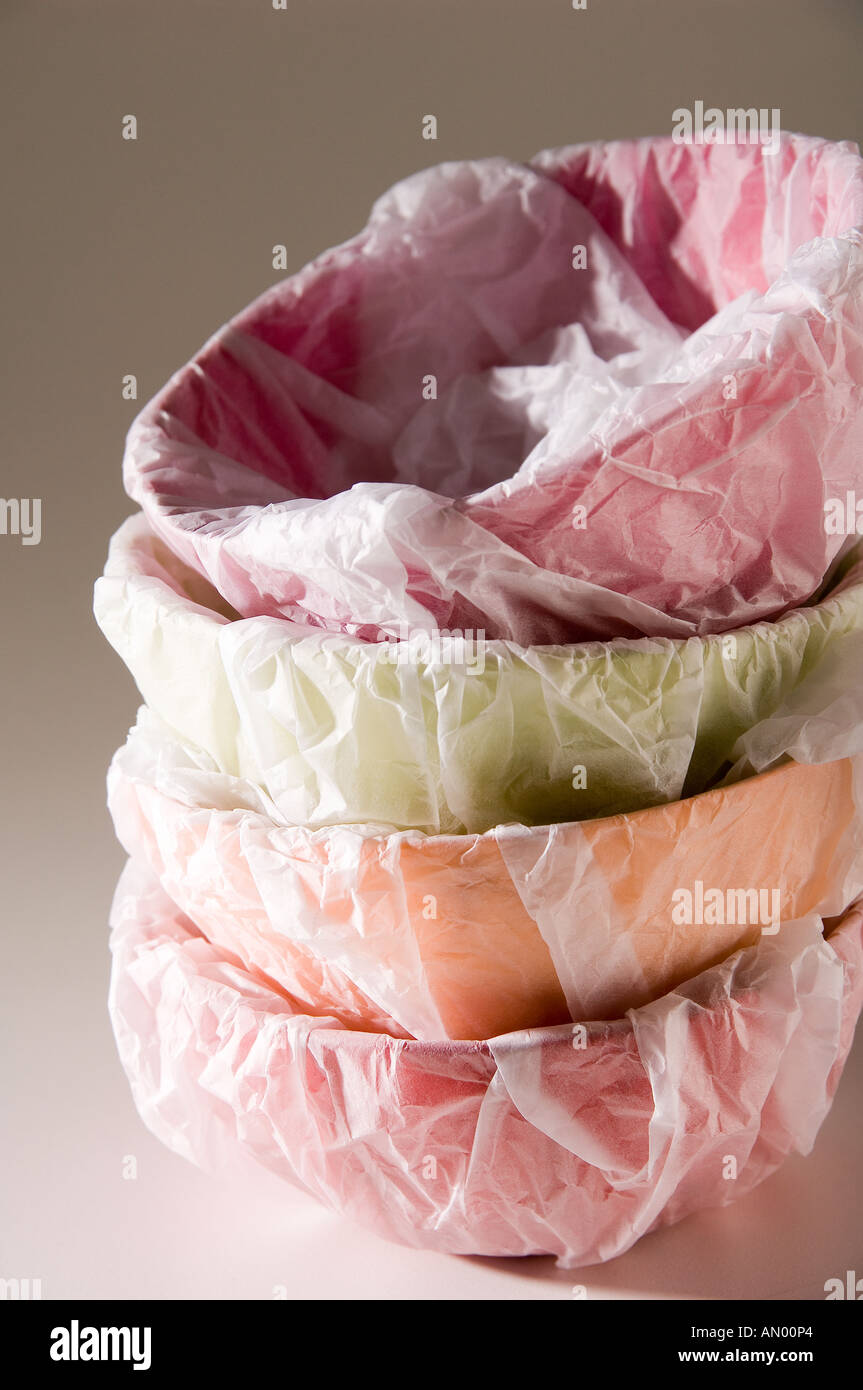 Set of papiermâché multicoloured bowls, wrapped in white tissue paper