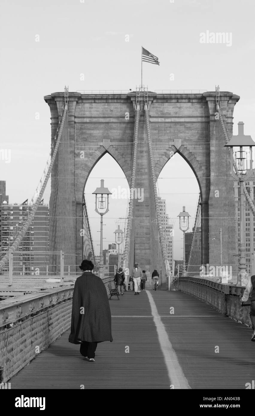 Man walking suspension bridge Black and White Stock Photos & Images - Alamy