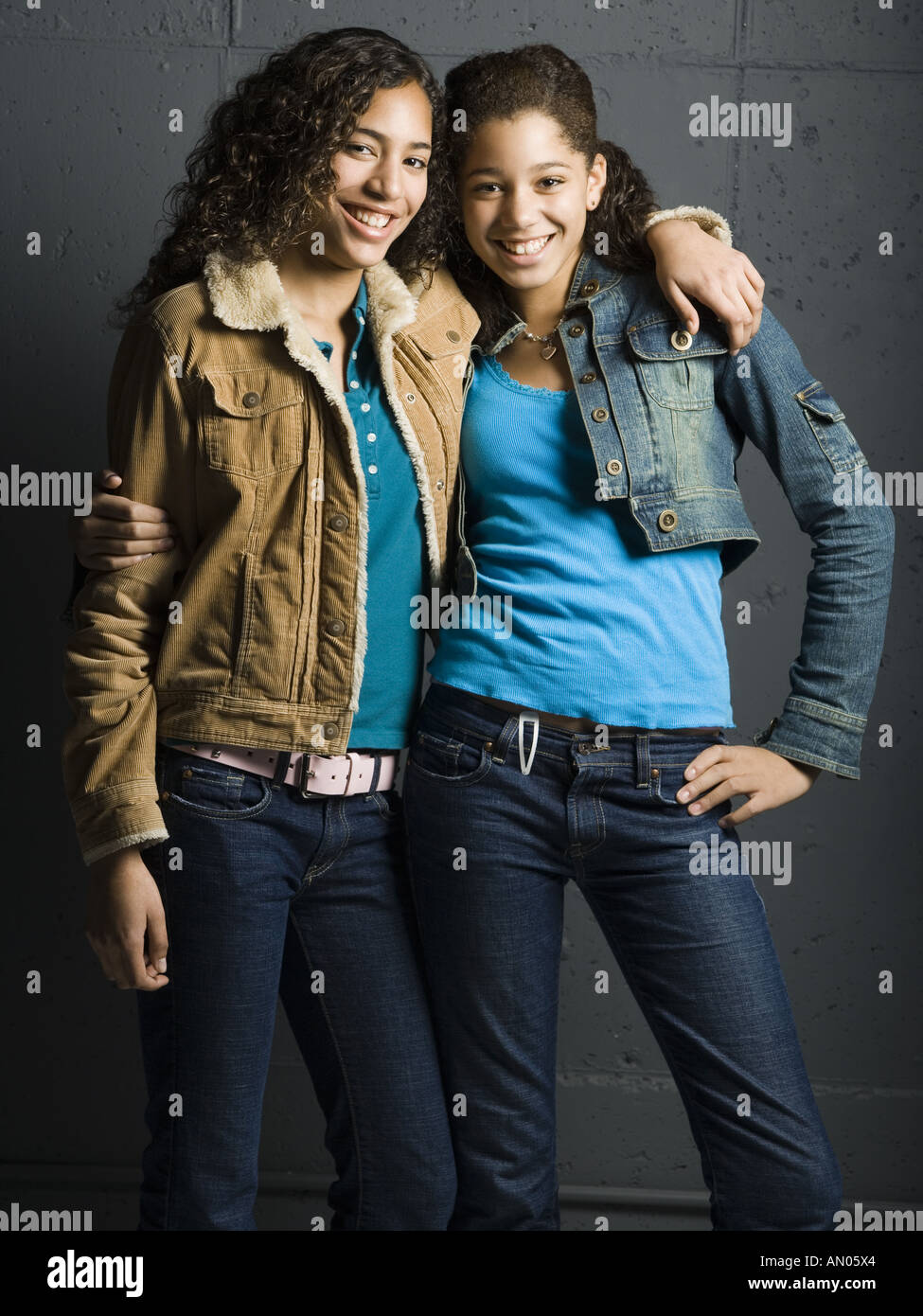 Portrait of two teenage girls smiling Stock Photo - Alamy
