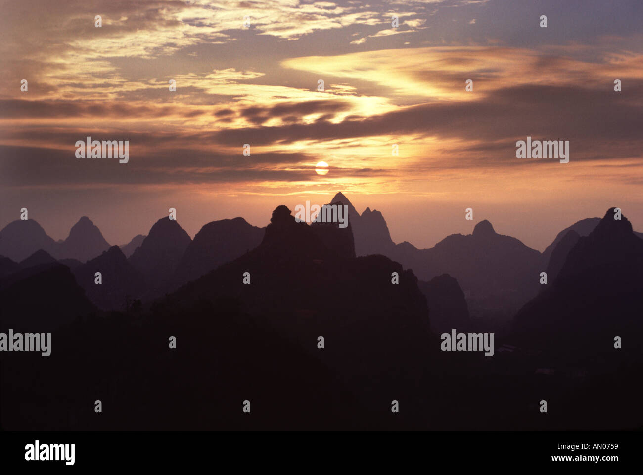 Magnificent sunset over Folded Brocade Hills Guilin China Stock Photo