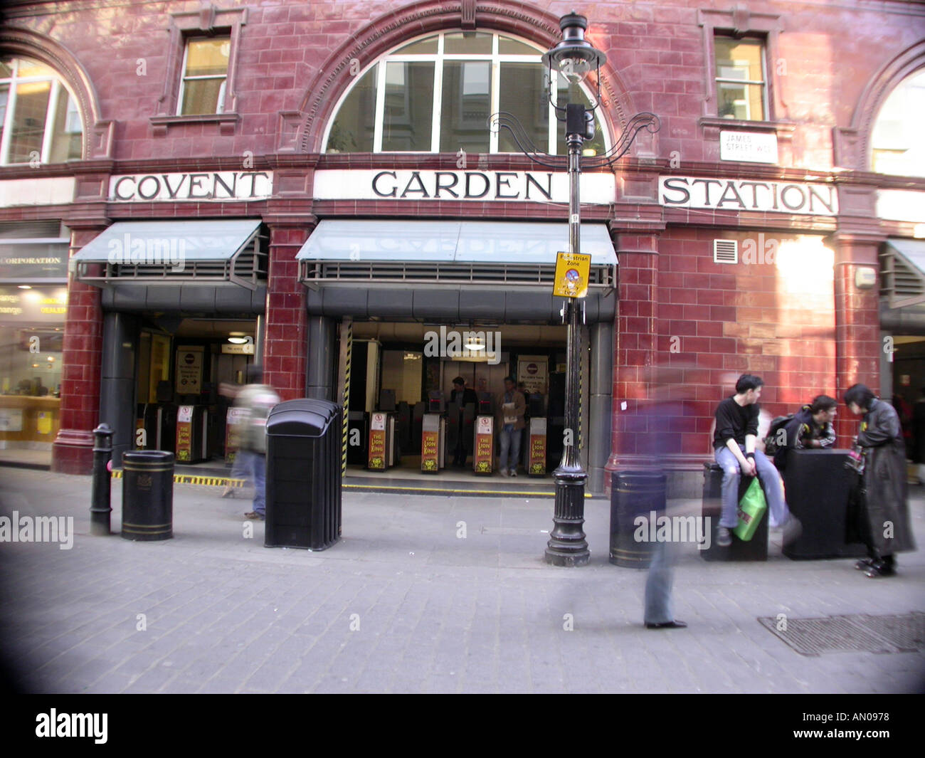 Covent Garden tube station London with blurred passers by Stock Photo