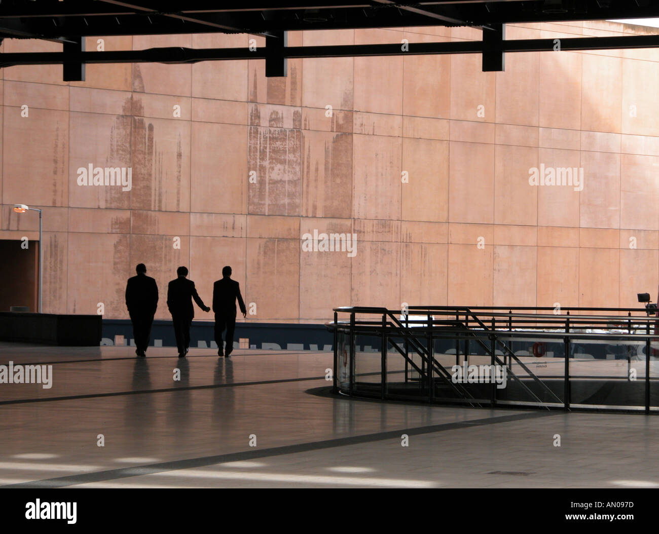 Silhouette of three businessmen walking in Broadgate centre , City of London Stock Photo