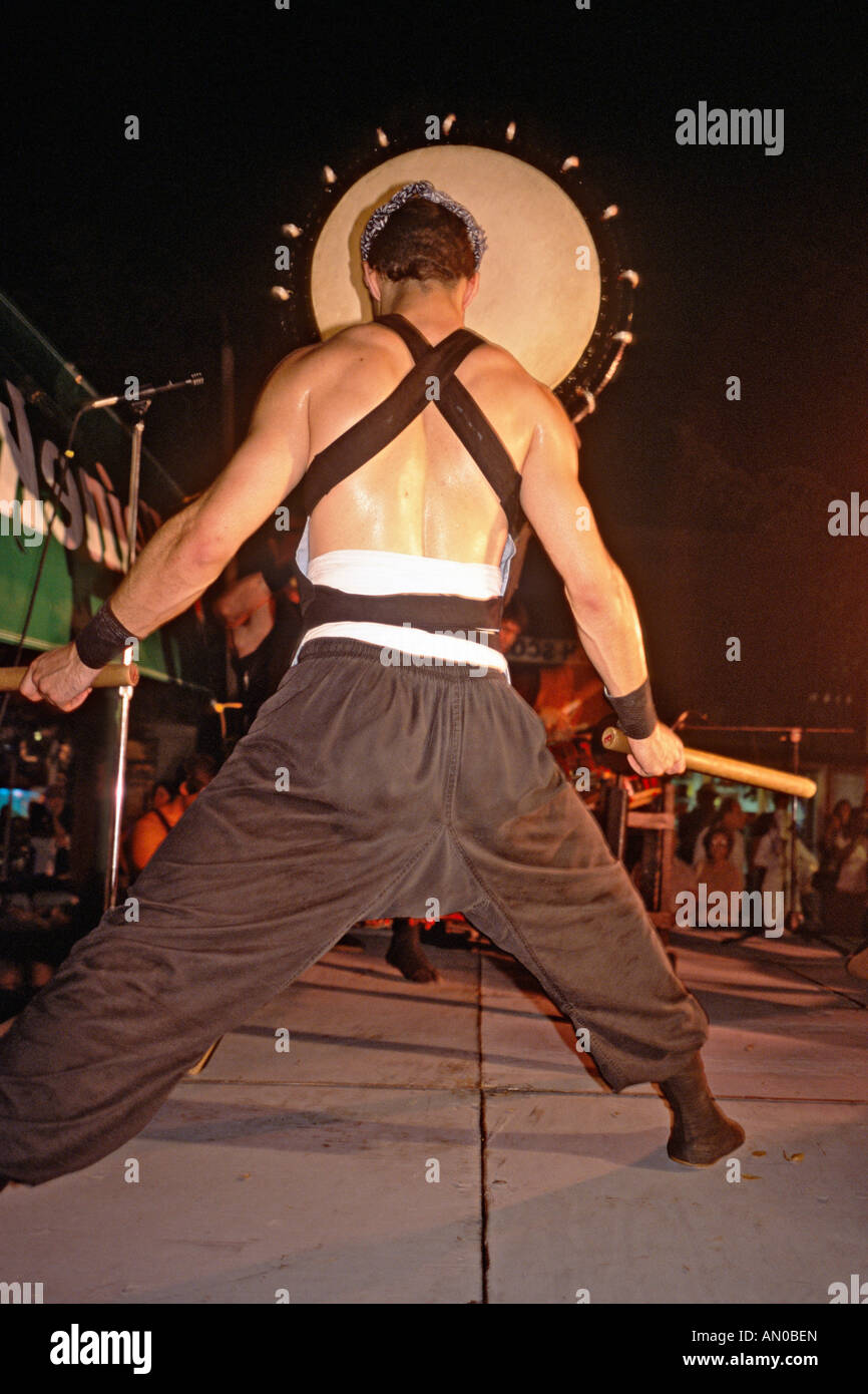 Japanese taiko drummer performing at a neighborhood festival in Coconut