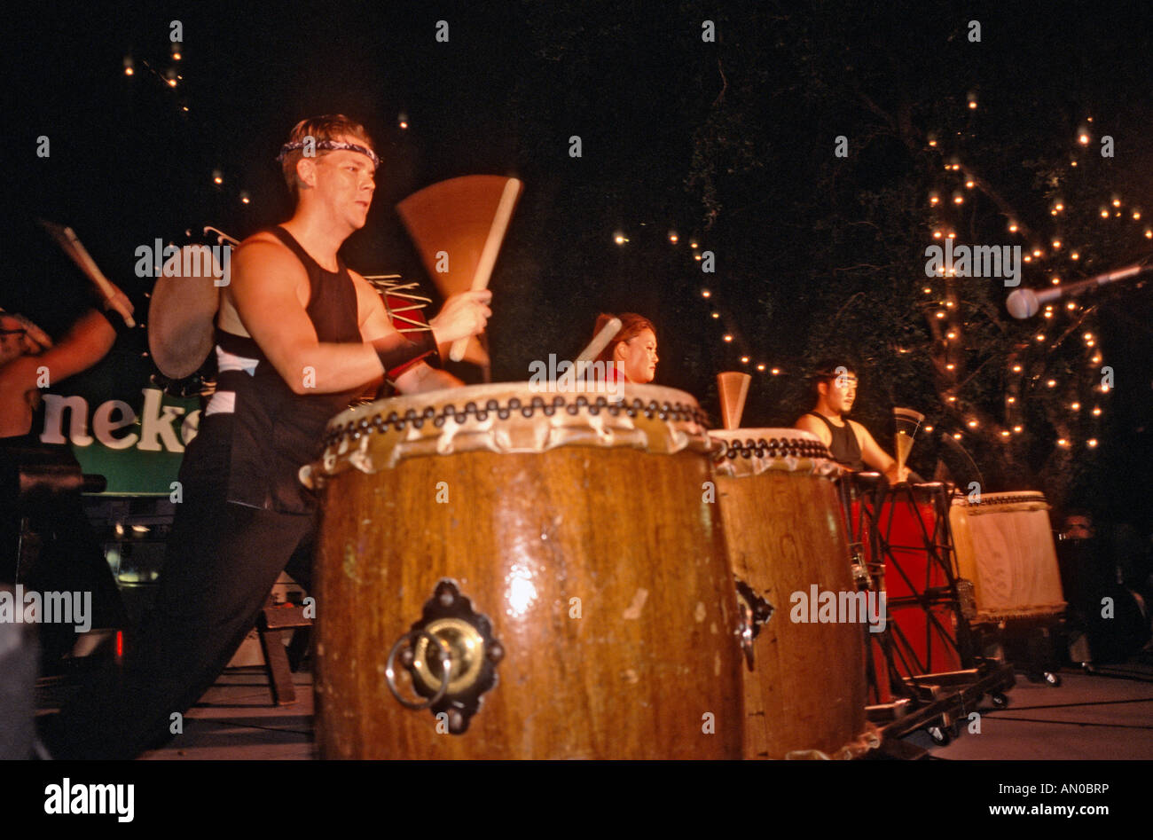 Japanese taiko drummers performing at a neighborhood festival in