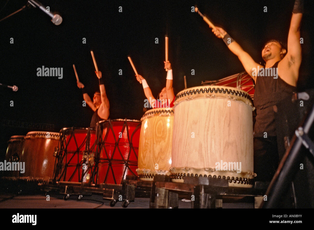 Japanese taiko drummers performing at a neighborhood festival in