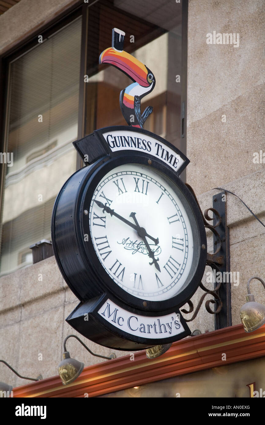 Clock outside an Irish Pub in Las Palmas, Canaries Stock Photo Alamy