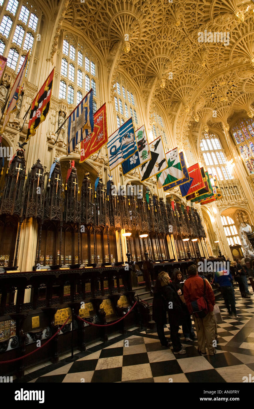 UK London Westminster Abbey Lady Chapel constructed by Henry VII heraldic banners above decoratively carved oak choir stalls Stock Photo