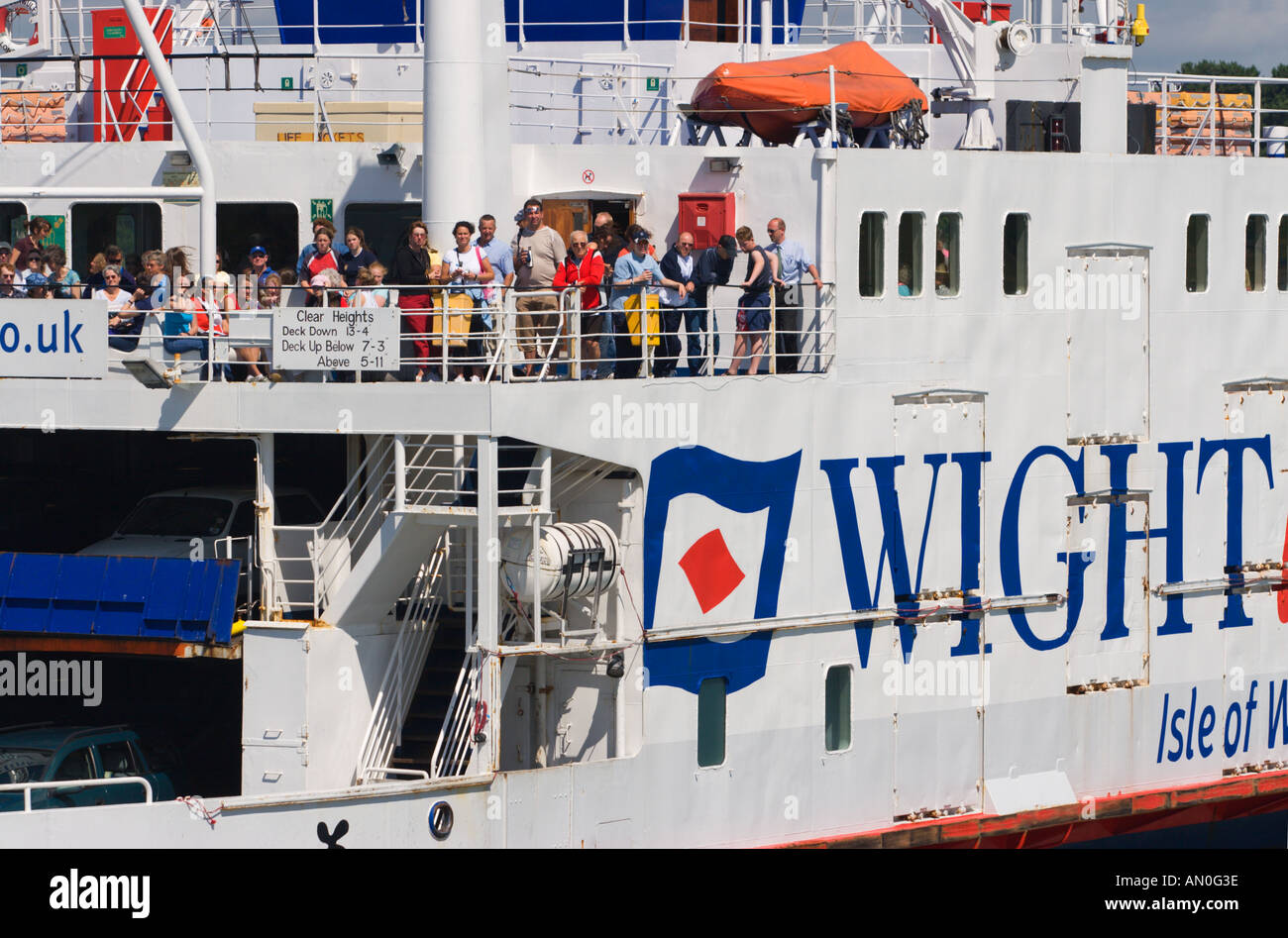 Close up of Wightlink Isle of Wight car & passenger ferry with people looking from railing as it sails from Lymington England Stock Photo