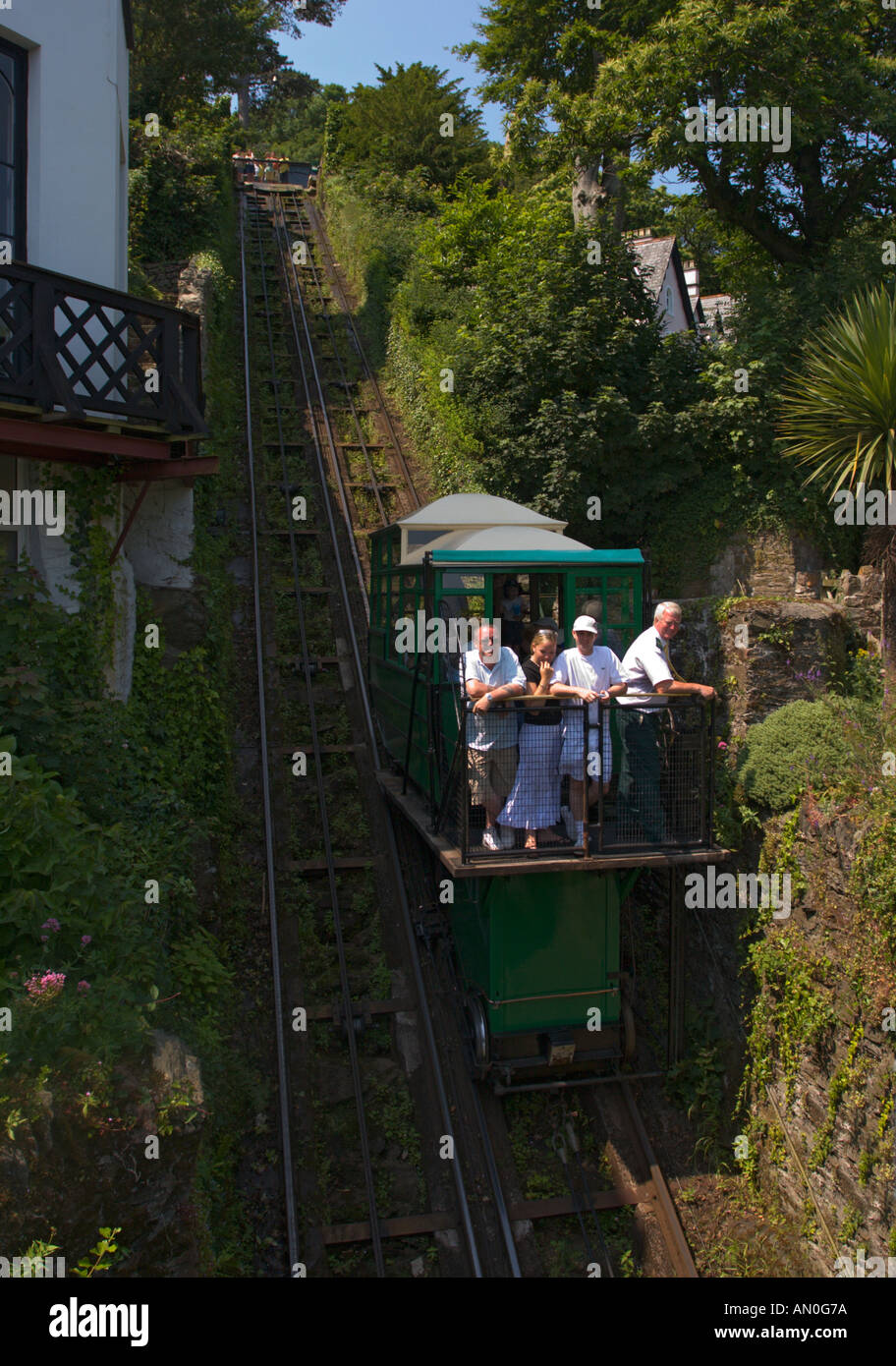 People at the front of the famous very steep cliff railway descending from Lynton to Lynmouth North Devon England Stock Photo
