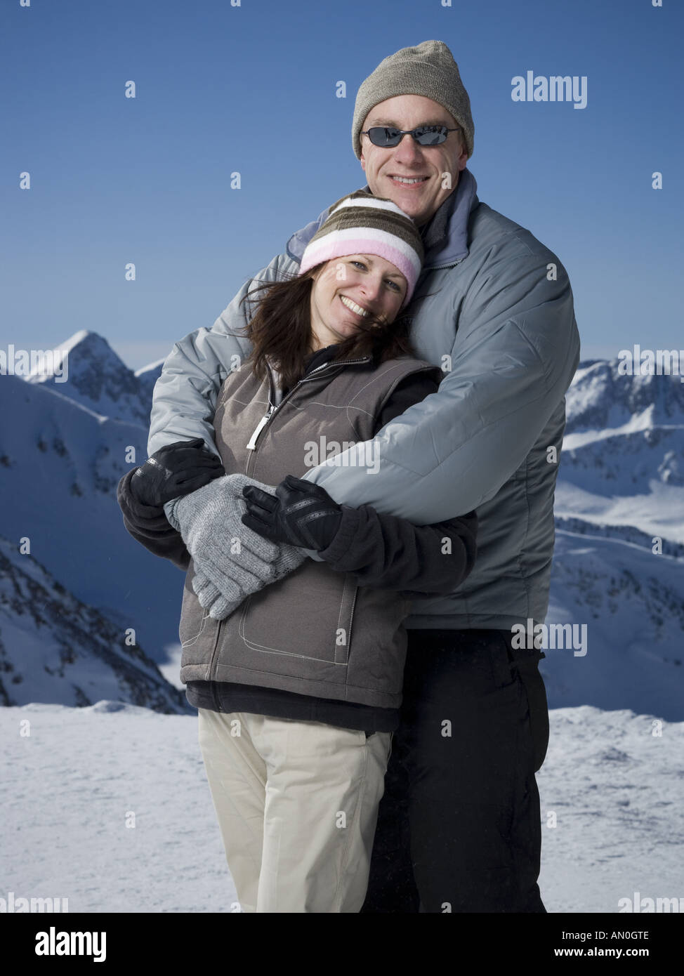 Portrait of a mature man embracing a mature woman from behind Stock ...