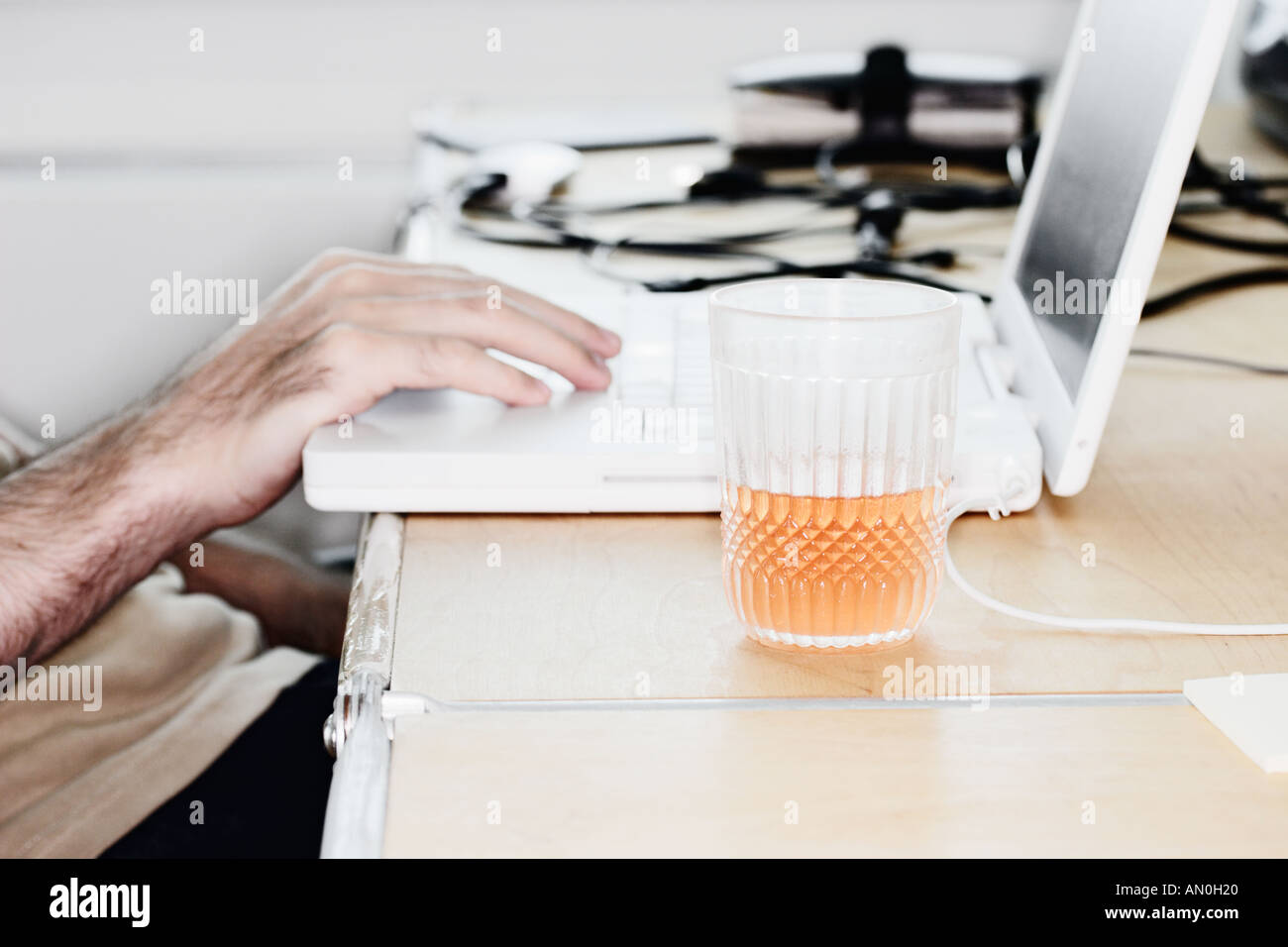 Man Sitting At Laptop Stock Photo