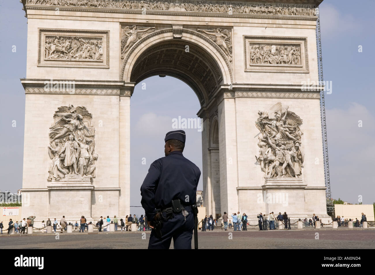 Policeman in uniform waits for driving offenses on the Avenue des Champs Elysees in Paris May 2005 Stock Photo
