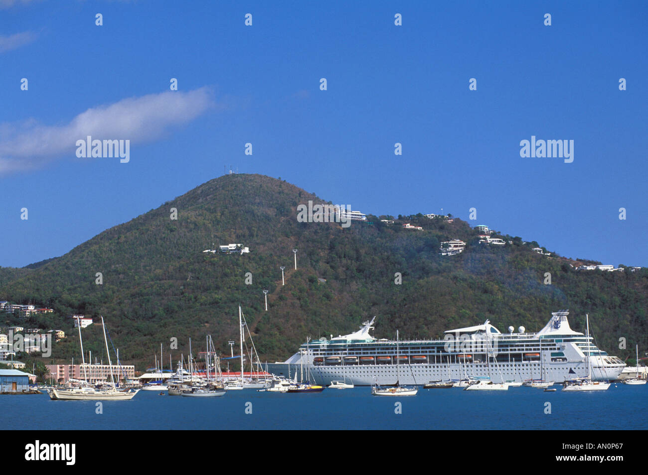 St Thomas USVI Charlotte Amalie Caribbean cruise port harbor with cruise ship and sailboats in front of hillside Stock Photo