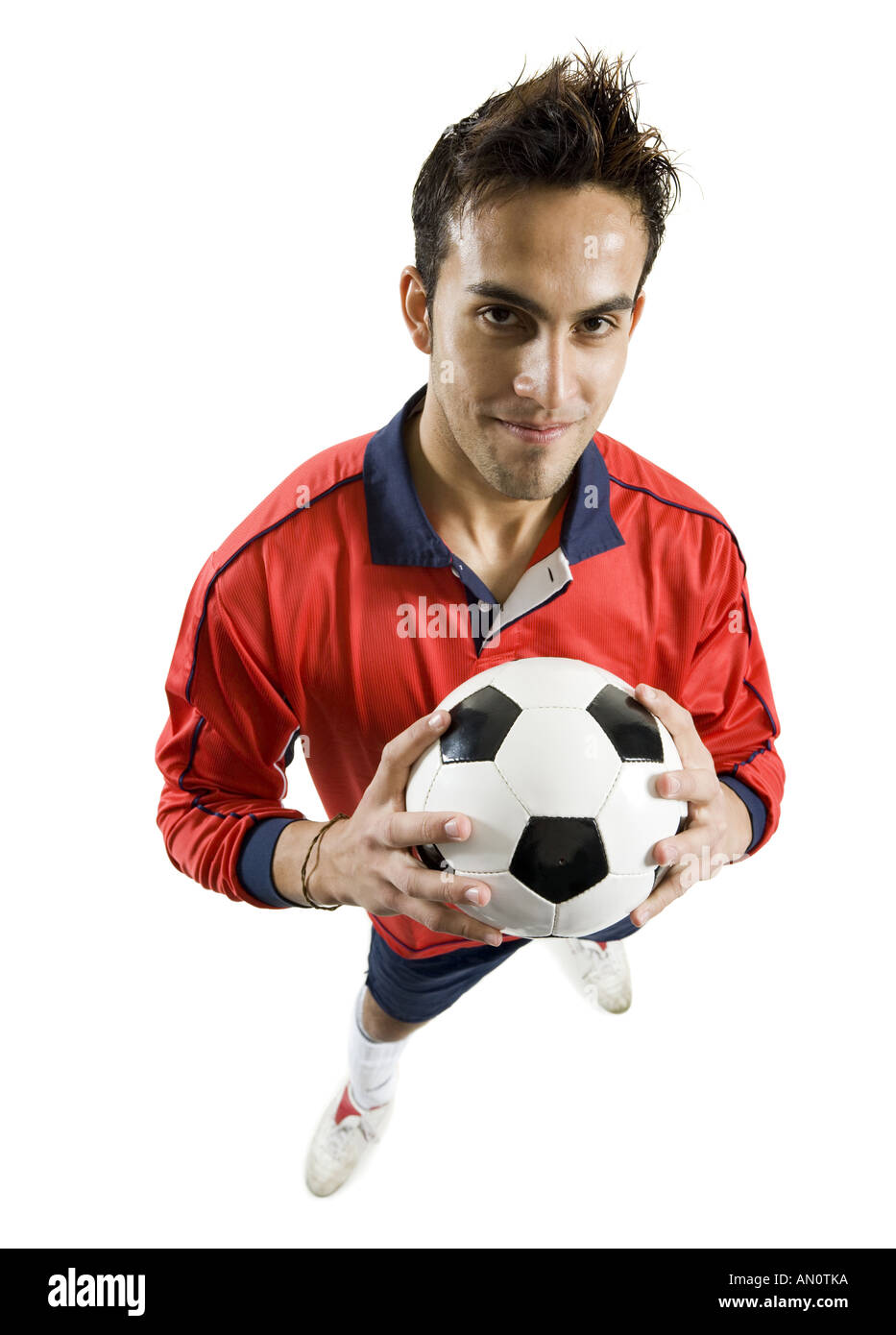 Portrait of a young man holding a soccer ball Stock Photo - Alamy