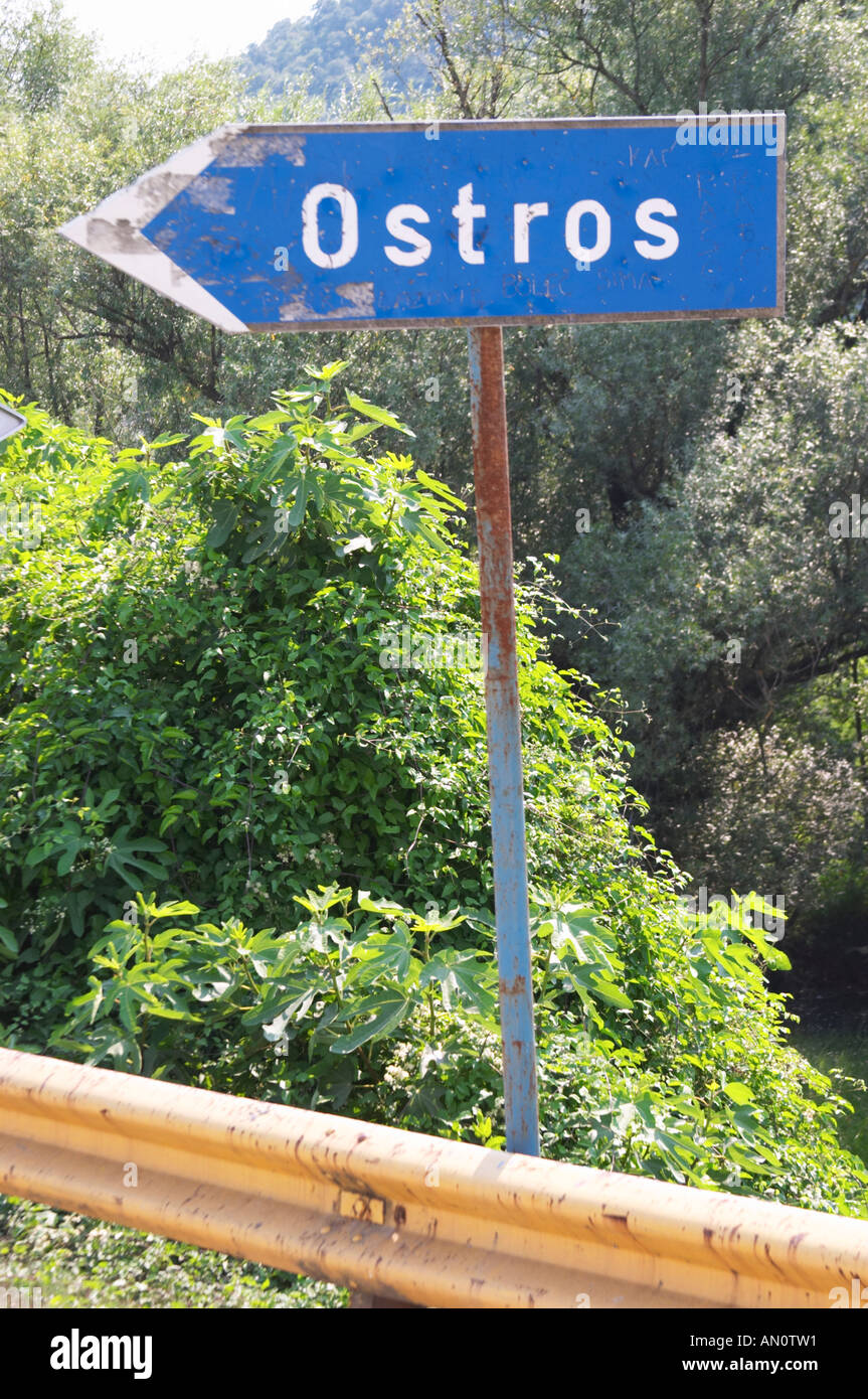Blue rusty Road side sign pointing left saying Ostros. Near Dupilo ...