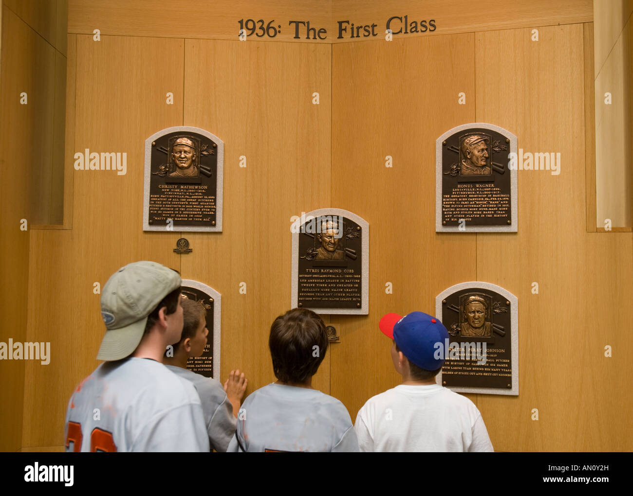 Boys looking at plaques of baseball players at the Baseball Hall of Fame Stock Photo