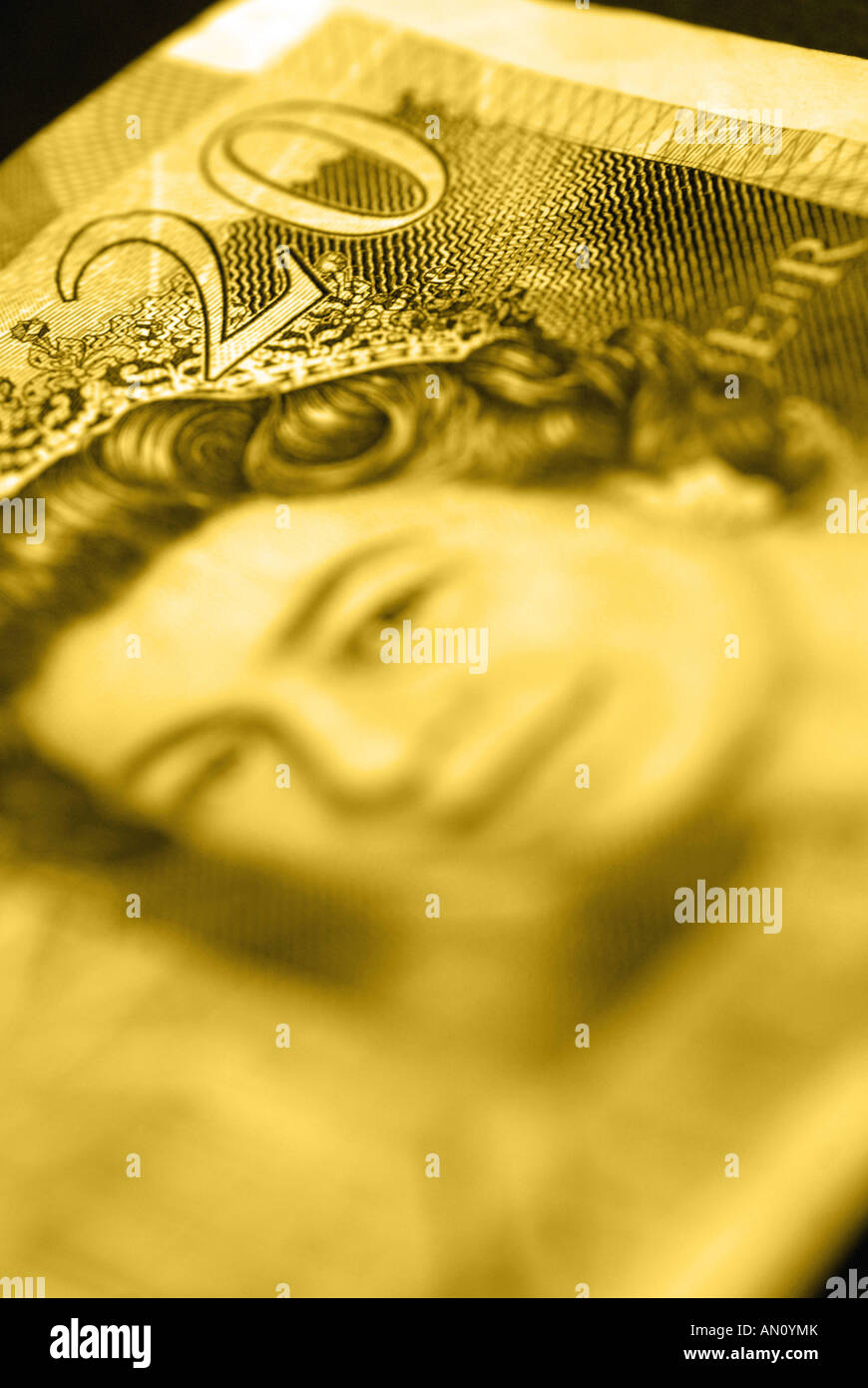 Macro shot of a twenty pound note with a yellow colour cast Stock Photo
