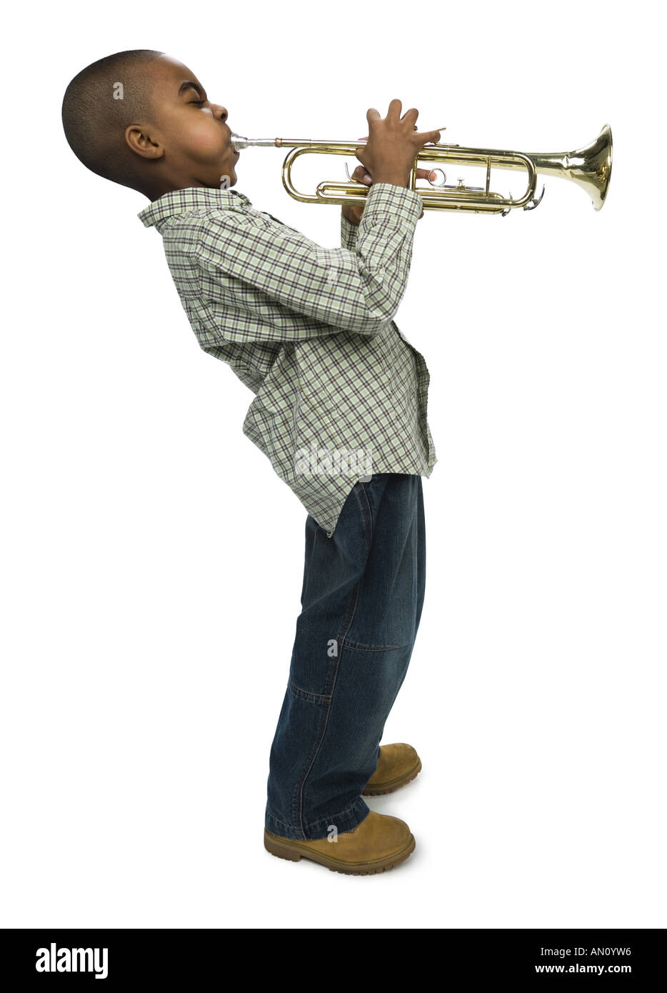 Young boy practicing playing trumpet in living room at home Stock Photo -  Alamy